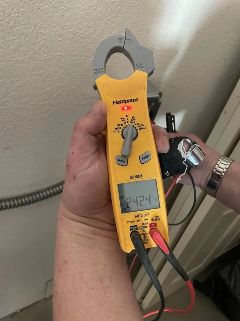 Voltage testing with clamp meter during Generator Installation in Oakfield